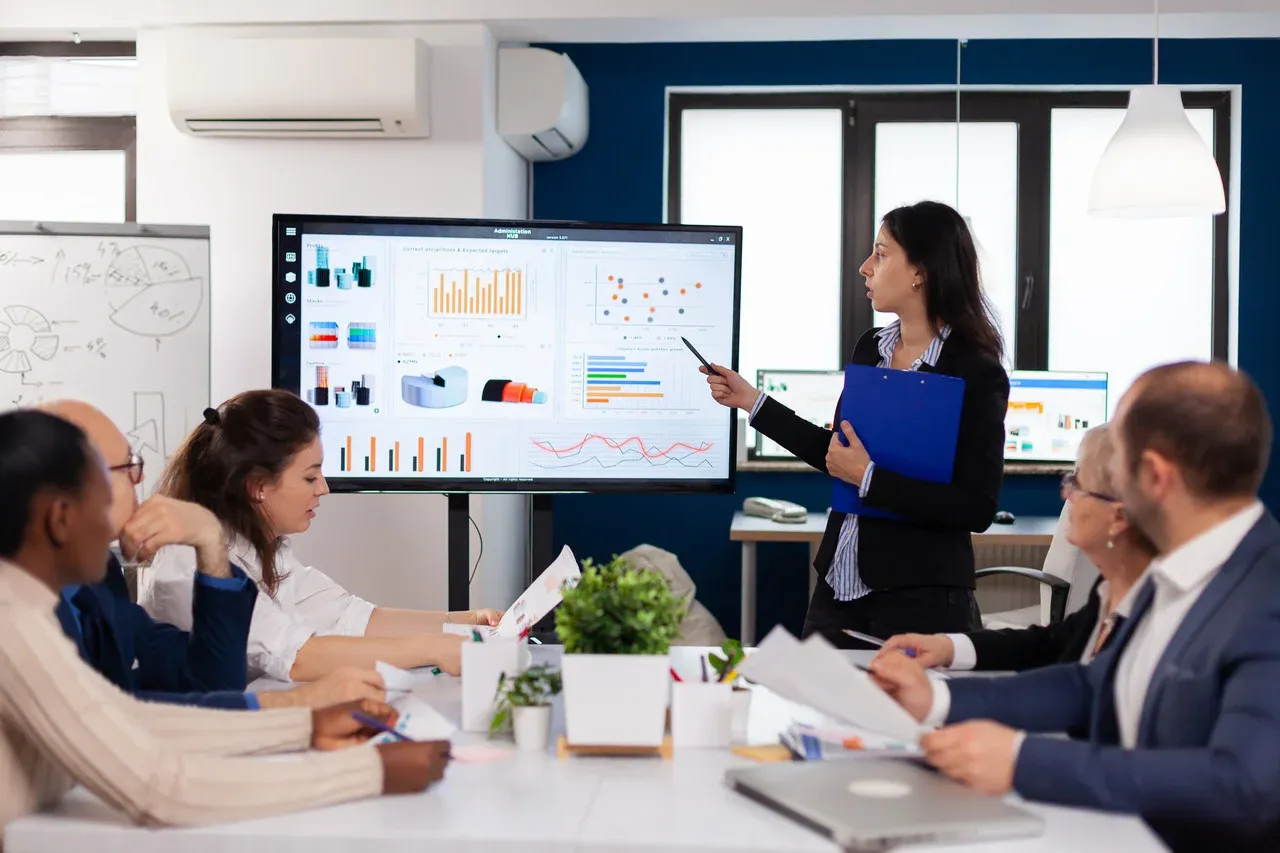 Team leader briefing coworkers in an office