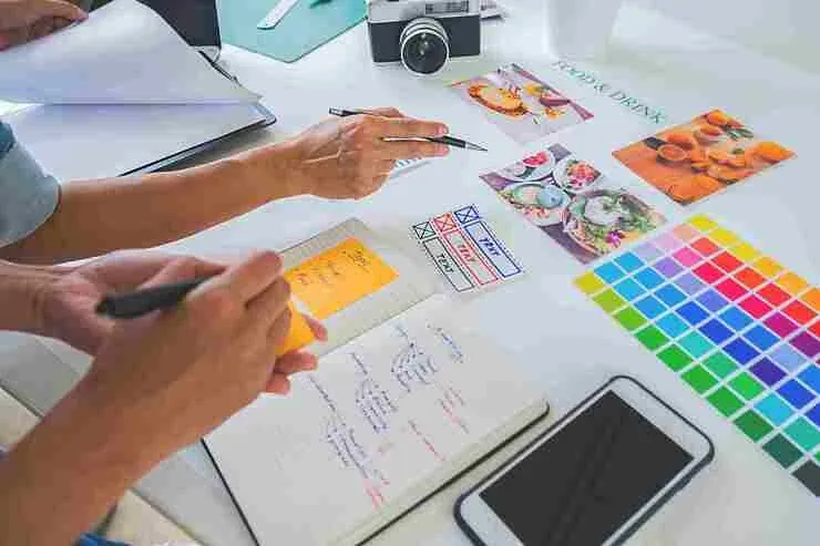 Startup creative team discussing advertising ideas in an office