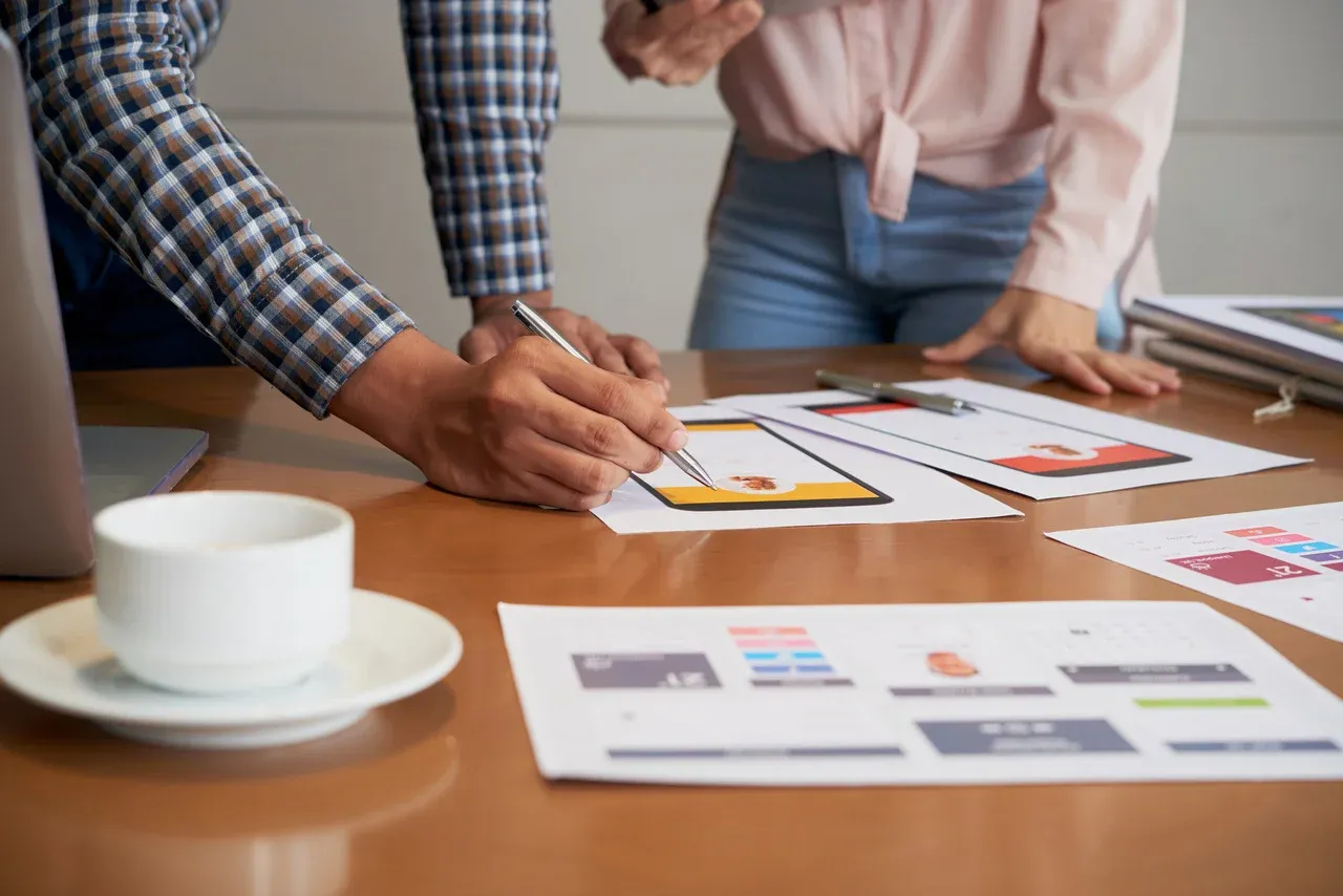 Front-end developers designing a mobile app interface